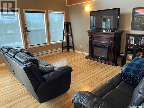 104 Sunridge Road, Pebble Baye, SK - Indoor Photo Showing Living Room With Fireplace