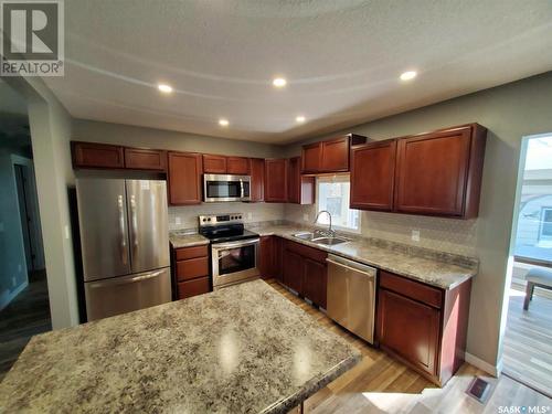 10 Mountain Drive, Carlyle, SK - Indoor Photo Showing Kitchen With Double Sink