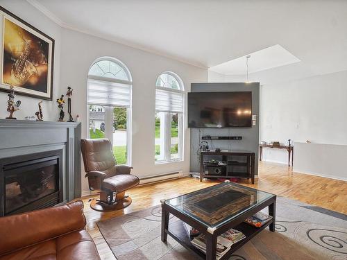 Living room - 71 Rue De La Pulperie, Saint-Jérôme, QC - Indoor Photo Showing Living Room With Fireplace