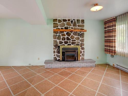 Family room - 206 Rue Filion, Laval (Sainte-Rose), QC - Indoor With Fireplace