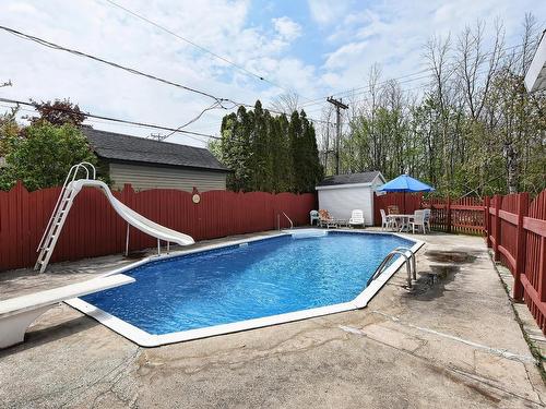 ExtÃ©rieur - 206 Rue Filion, Laval (Sainte-Rose), QC - Outdoor With In Ground Pool With Backyard