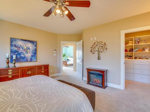 3748 Meares Dr, Port Alberni, BC - Indoor Photo Showing Bedroom With Fireplace