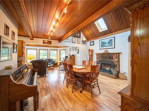 375 Neill St, Tofino, BC - Indoor Photo Showing Dining Room With Fireplace