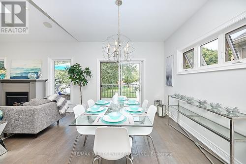 14 - 12 Cobblestone Drive, Niagara-On-The-Lake, ON - Indoor Photo Showing Dining Room With Fireplace