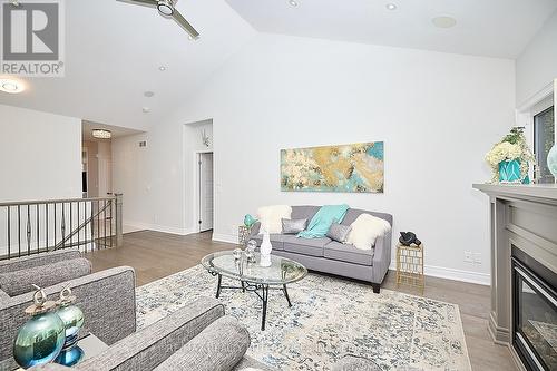 14 - 12 Cobblestone Drive, Niagara-On-The-Lake, ON - Indoor Photo Showing Living Room With Fireplace