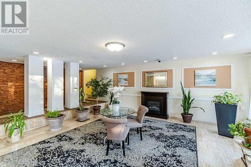 701 - 335 Driftwood Avenue, Toronto (Black Creek), ON - Indoor Photo Showing Living Room With Fireplace