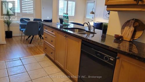 409 - 10 Mendelssohn Street, Toronto (Clairlea-Birchmount), ON - Indoor Photo Showing Kitchen With Double Sink