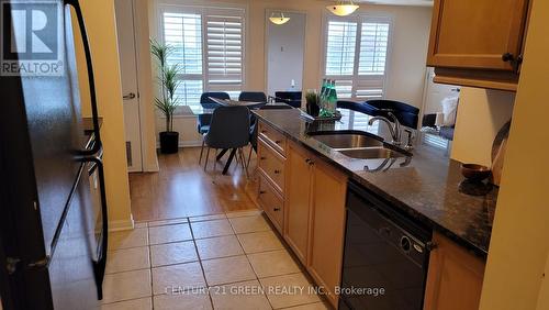 409 - 10 Mendelssohn Street, Toronto (Clairlea-Birchmount), ON - Indoor Photo Showing Kitchen With Double Sink