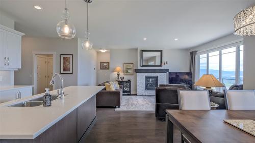 1740 Tower Ranch Drive, Kelowna, BC - Indoor Photo Showing Kitchen With Fireplace With Double Sink