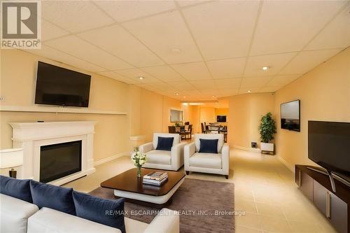 15 - 484 Millen Road, Hamilton (Lakeshore), ON - Indoor Photo Showing Living Room With Fireplace