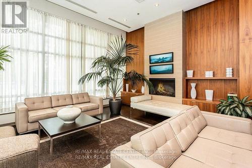 411 - 1 Elm Drive, Mississauga (City Centre), ON - Indoor Photo Showing Living Room With Fireplace