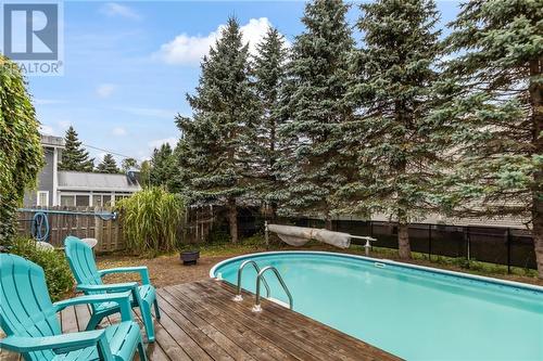 87 Chiasson, Dieppe, NB - Outdoor With Above Ground Pool With Deck Patio Veranda With Backyard