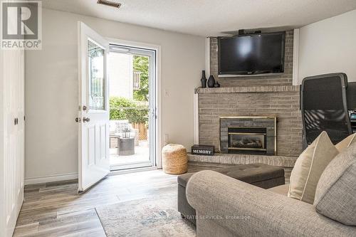 22 - 1155 Paramount Drive, Hamilton, ON - Indoor Photo Showing Living Room With Fireplace