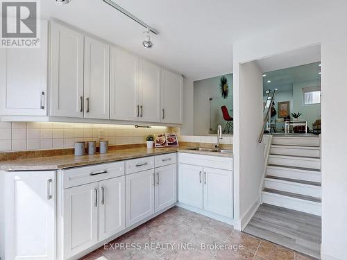 18 - 1666 Queen Street E, Toronto (Woodbine Corridor), ON - Indoor Photo Showing Kitchen With Double Sink