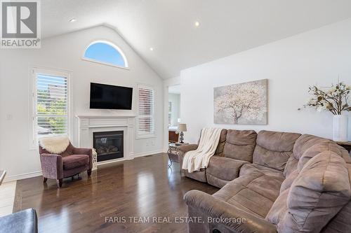 19 Cameron Street, Springwater (Centre Vespra), ON - Indoor Photo Showing Living Room With Fireplace