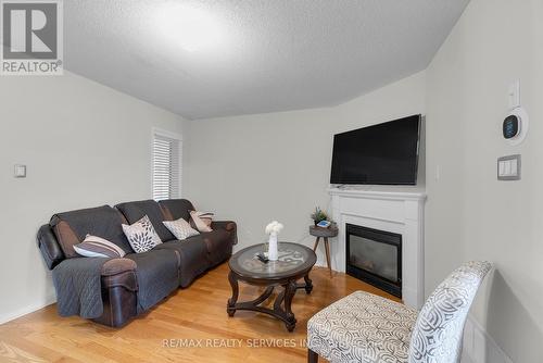 22 Tanasi Road, Brampton (Credit Valley), ON - Indoor Photo Showing Living Room With Fireplace