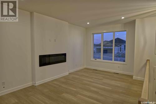 608 Weir Crescent, Warman, SK - Indoor With Fireplace