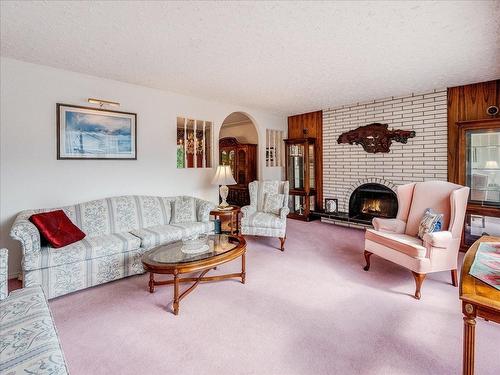 1731 Barrett Drive, Fruitvale, BC - Indoor Photo Showing Living Room With Fireplace