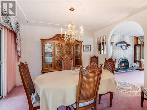 1731 Barrett  Drive, Fruitvale, BC - Indoor Photo Showing Dining Room With Fireplace