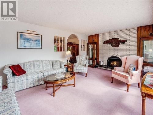 1731 Barrett  Drive, Fruitvale, BC - Indoor Photo Showing Living Room With Fireplace