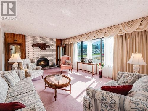 1731 Barrett  Drive, Fruitvale, BC - Indoor Photo Showing Living Room With Fireplace