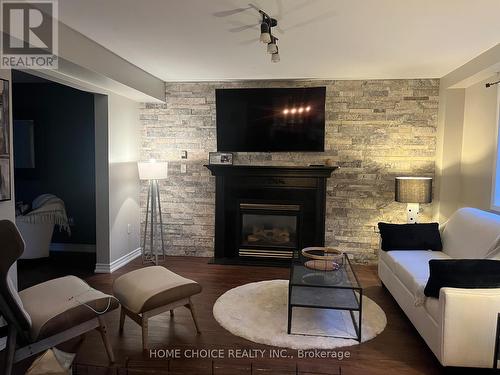 14 Snowy Owl Crescent, Barrie (Little Lake), ON - Indoor Photo Showing Living Room With Fireplace