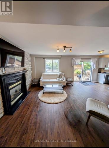 14 Snowy Owl Crescent, Barrie (Little Lake), ON - Indoor Photo Showing Living Room With Fireplace