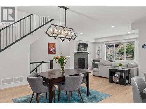 3026 Riesling Place, West Kelowna, BC - Indoor Photo Showing Dining Room With Fireplace