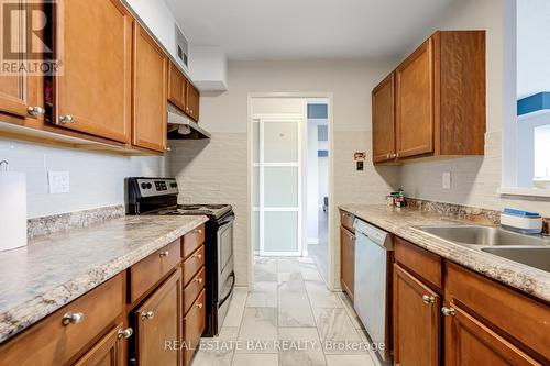 612 - 3077 Weston Road N, Toronto (Humberlea-Pelmo Park), ON - Indoor Photo Showing Kitchen With Double Sink