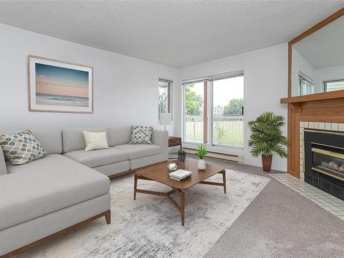 201-1234 Fort St, Victoria, BC - Indoor Photo Showing Living Room With Fireplace