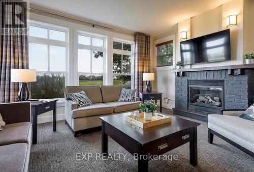 110 - 115 Fairway Court, Blue Mountains, ON - Indoor Photo Showing Living Room With Fireplace