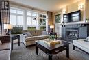 110 - 115 Fairway Court, Blue Mountains, ON  - Indoor Photo Showing Living Room With Fireplace 