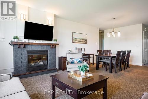 110 - 115 Fairway Court, Blue Mountains, ON - Indoor Photo Showing Living Room With Fireplace