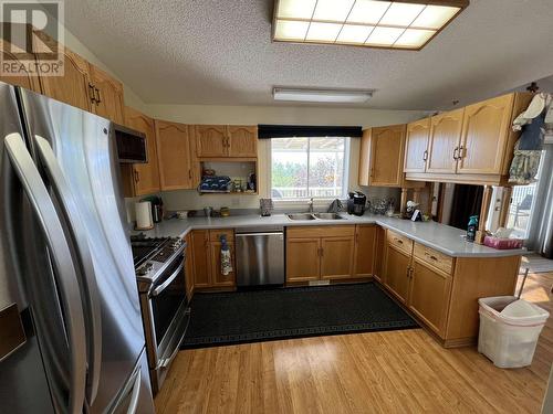 3 Pebble Drive, Fort Nelson, BC - Indoor Photo Showing Kitchen With Double Sink