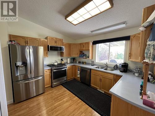 3 Pebble Drive, Fort Nelson, BC - Indoor Photo Showing Kitchen With Double Sink