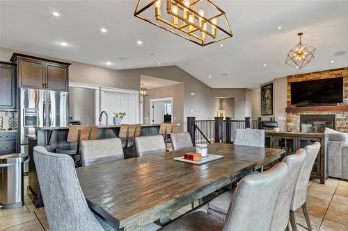 6032 Lynx Drive, Vernon, BC - Indoor Photo Showing Dining Room With Fireplace