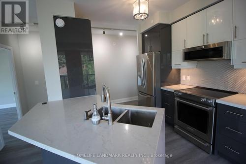 407 - 4700 Highway 7 Avenue, Vaughan, ON - Indoor Photo Showing Kitchen With Double Sink With Upgraded Kitchen