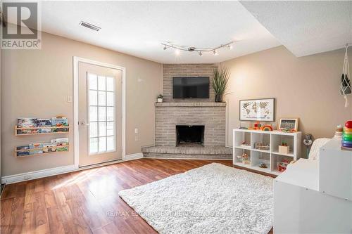 13 - 1155 Paramount Drive, Hamilton (Stoney Creek Mountain), ON - Indoor Photo Showing Living Room With Fireplace