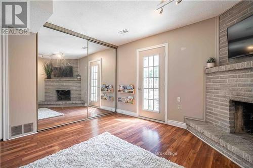 13 - 1155 Paramount Drive, Hamilton (Stoney Creek Mountain), ON - Indoor Photo Showing Living Room With Fireplace