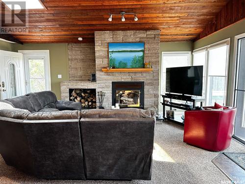 6 Sleepy Hollow Road, Jackfish Murray, SK - Indoor Photo Showing Living Room With Fireplace