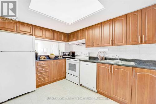 218 - 2466 Eglinton Avenue E, Toronto (Eglinton East), ON - Indoor Photo Showing Kitchen With Double Sink