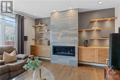 Stone Fireplace and floating shelving - 1870 Maple Grove Road, Ottawa, ON - Indoor Photo Showing Living Room With Fireplace