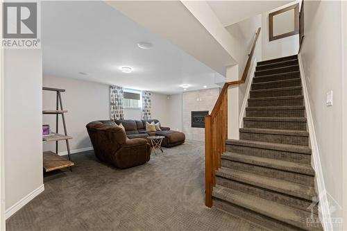 Fully Finished Basement with gas fireplace - 1870 Maple Grove Road, Ottawa, ON - Indoor Photo Showing Other Room