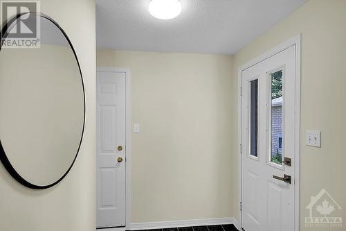 Front door on right, garage door on left - 87 Mullcraft Crescent, Ottawa, ON - Indoor Photo Showing Other Room