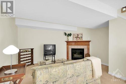 Basement gas fireplace - 87 Mullcraft Crescent, Ottawa, ON - Indoor Photo Showing Other Room With Fireplace