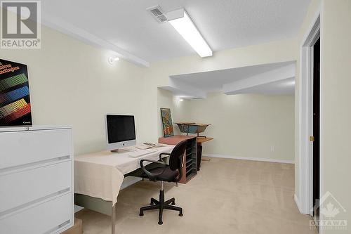 Long computer area/gym area with Utility room to the right. - 87 Mullcraft Crescent, Ottawa, ON - Indoor Photo Showing Office