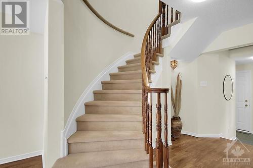 Curved staircase to the 2nd level. - 87 Mullcraft Crescent, Ottawa, ON - Indoor Photo Showing Other Room