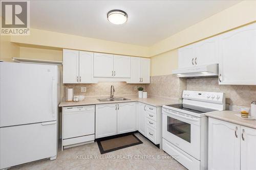 211 - 111 Grew Boulevard, Georgina (Sutton & Jackson'S Point), ON - Indoor Photo Showing Kitchen With Double Sink