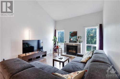 49 Springcreek Crescent, Ottawa, ON - Indoor Photo Showing Living Room With Fireplace