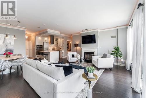 Ph404 - 88 Palace Pier Court, Toronto (Mimico), ON - Indoor Photo Showing Living Room With Fireplace